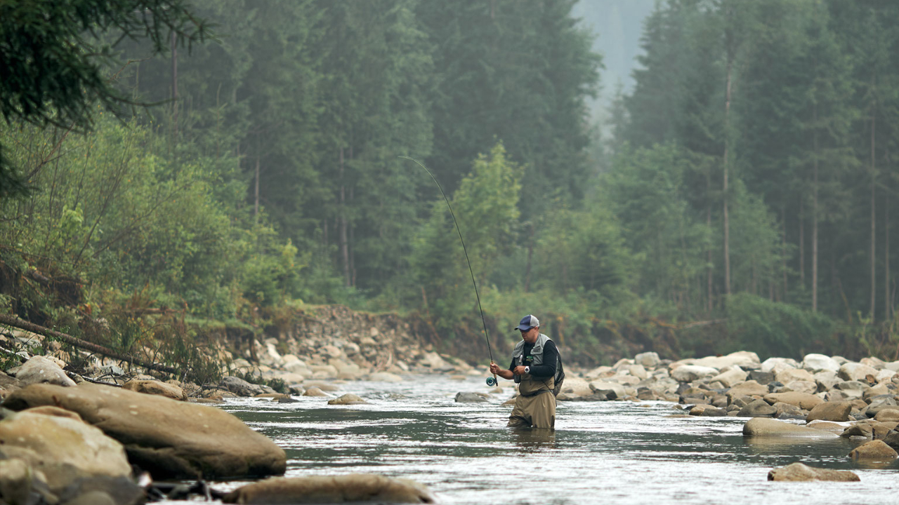 Oregon man fly fishing in river